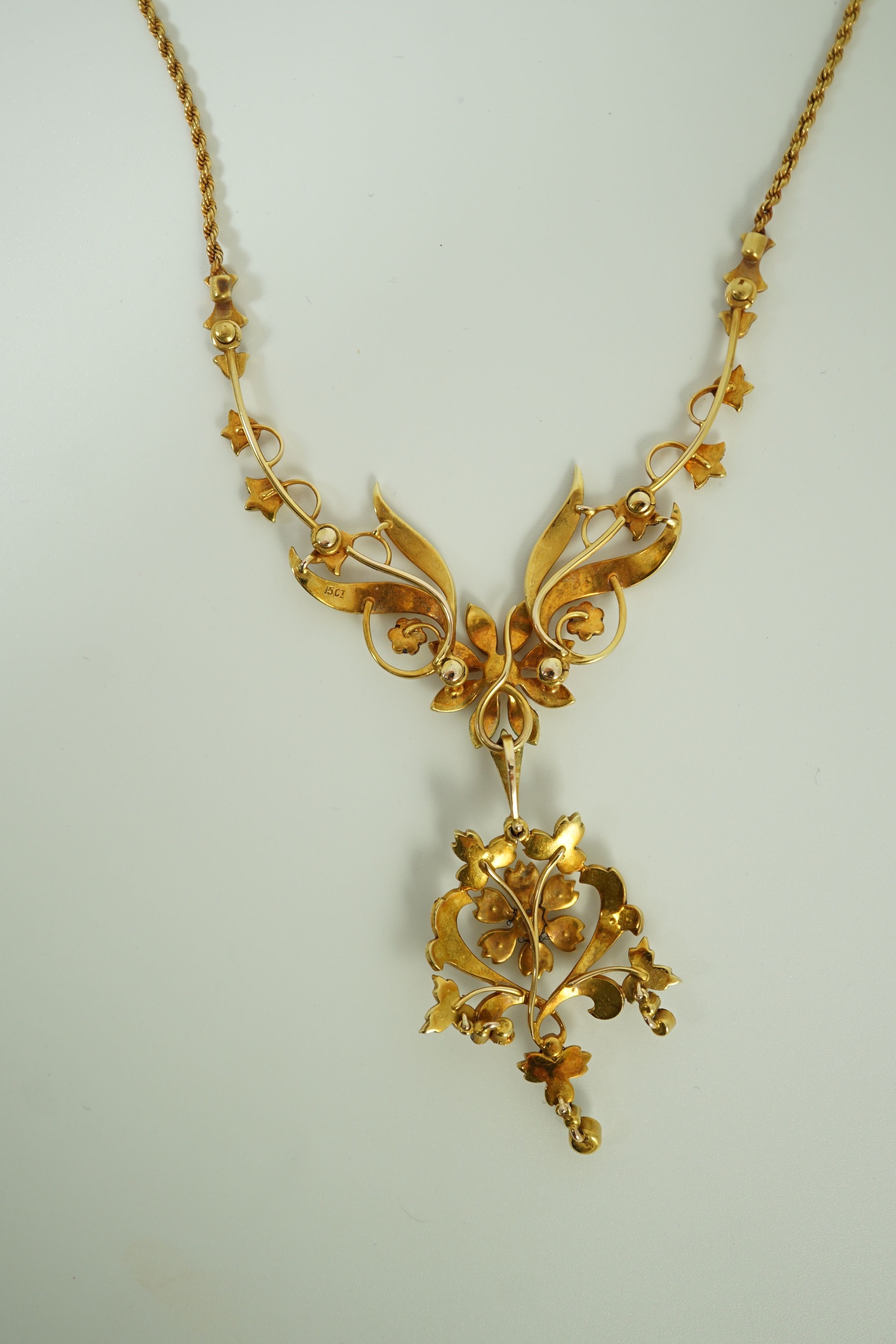 A late Victorian 15ct gold and seed pearl set drop pendant necklace